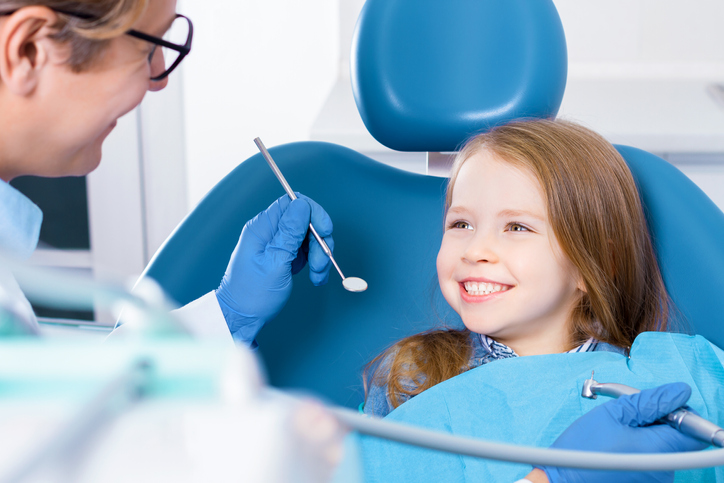 Young girl receiving pediatric dental treatment